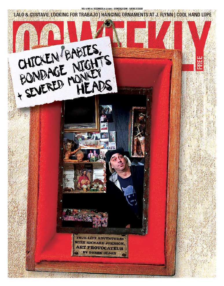 OC Weekly cover: a red-framed shadow box on a handwritten tag reading Chicken Babies, Bondage Nights and Severed Monkey Heads