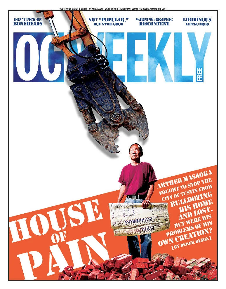 OC Weekly cover: a man holding a sign in front of a demolition claw, with the headline House of Pain
